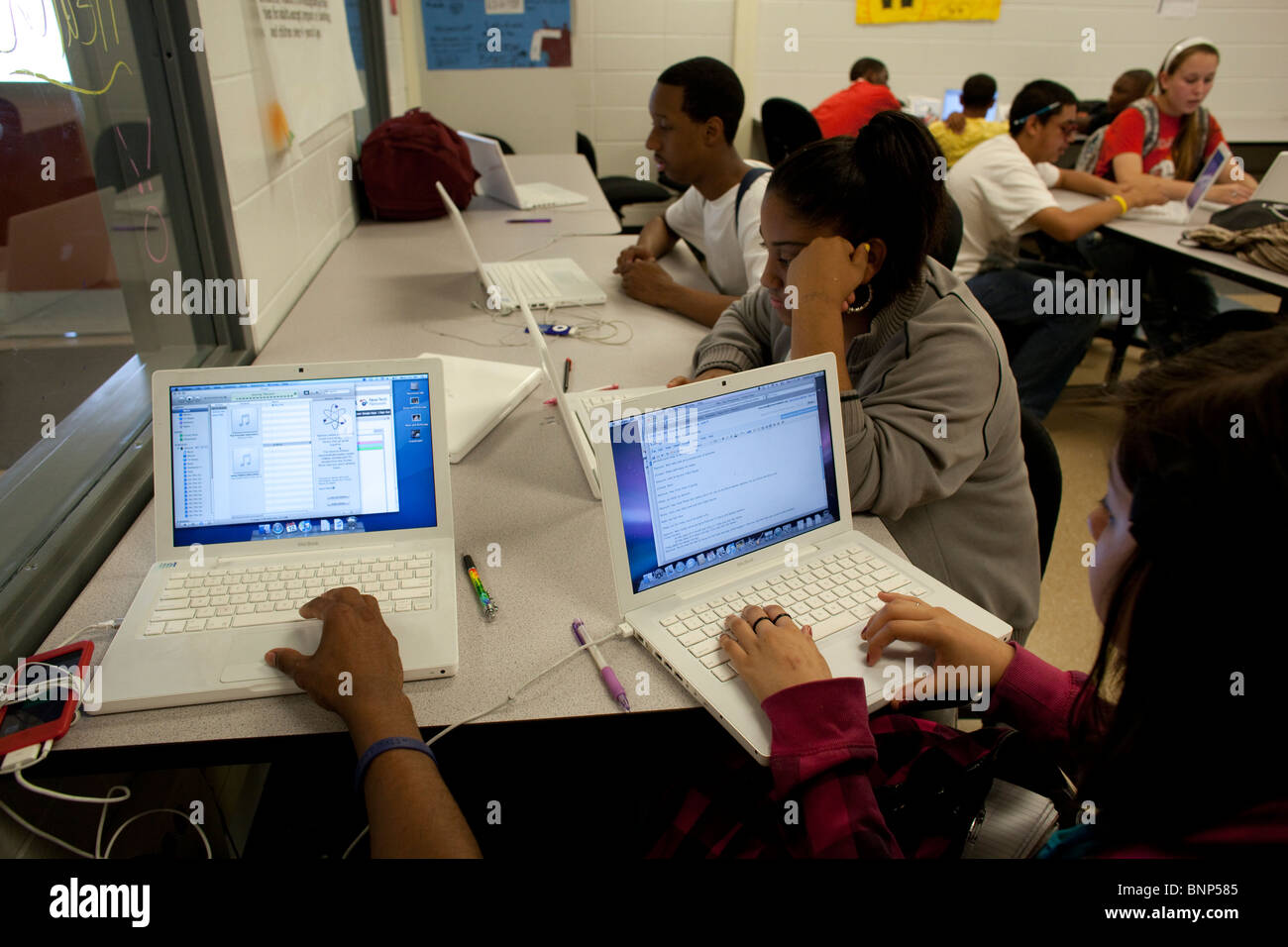 Students use MacBook laptop computers to do assignments in class at ...