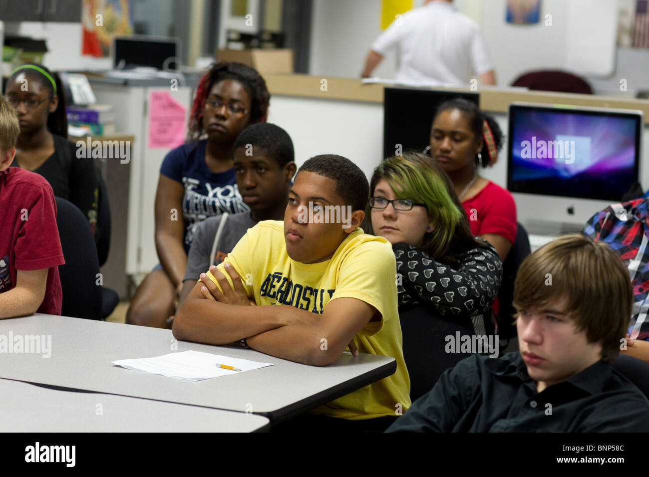 Ethnic, racial mix of students listen to teacher during class at Manor New Tech High School in Manor, Texas Stock Photo