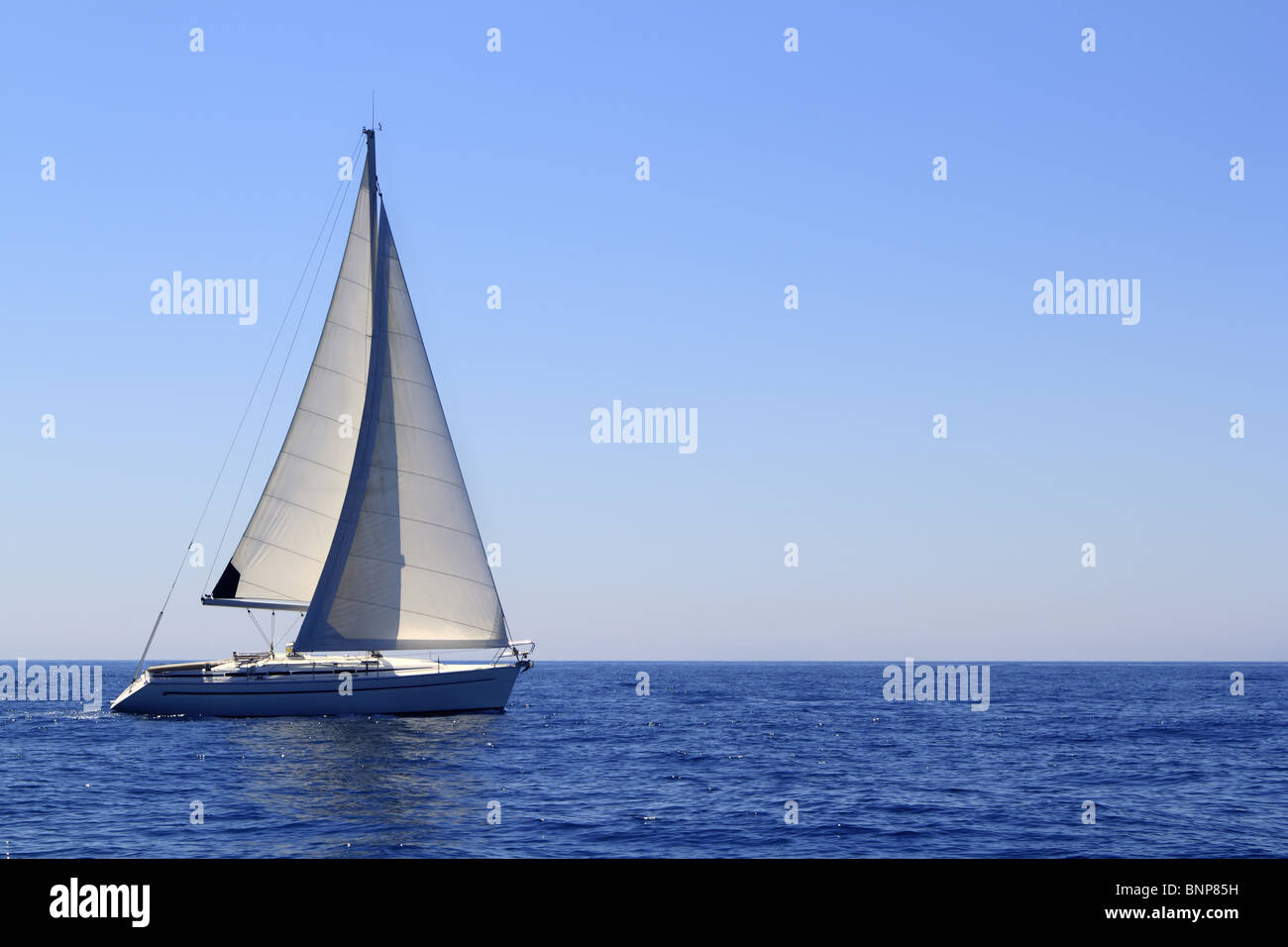 beautiful sailboat sailing sail blue Mediterranean sea ocean horizon Stock Photo