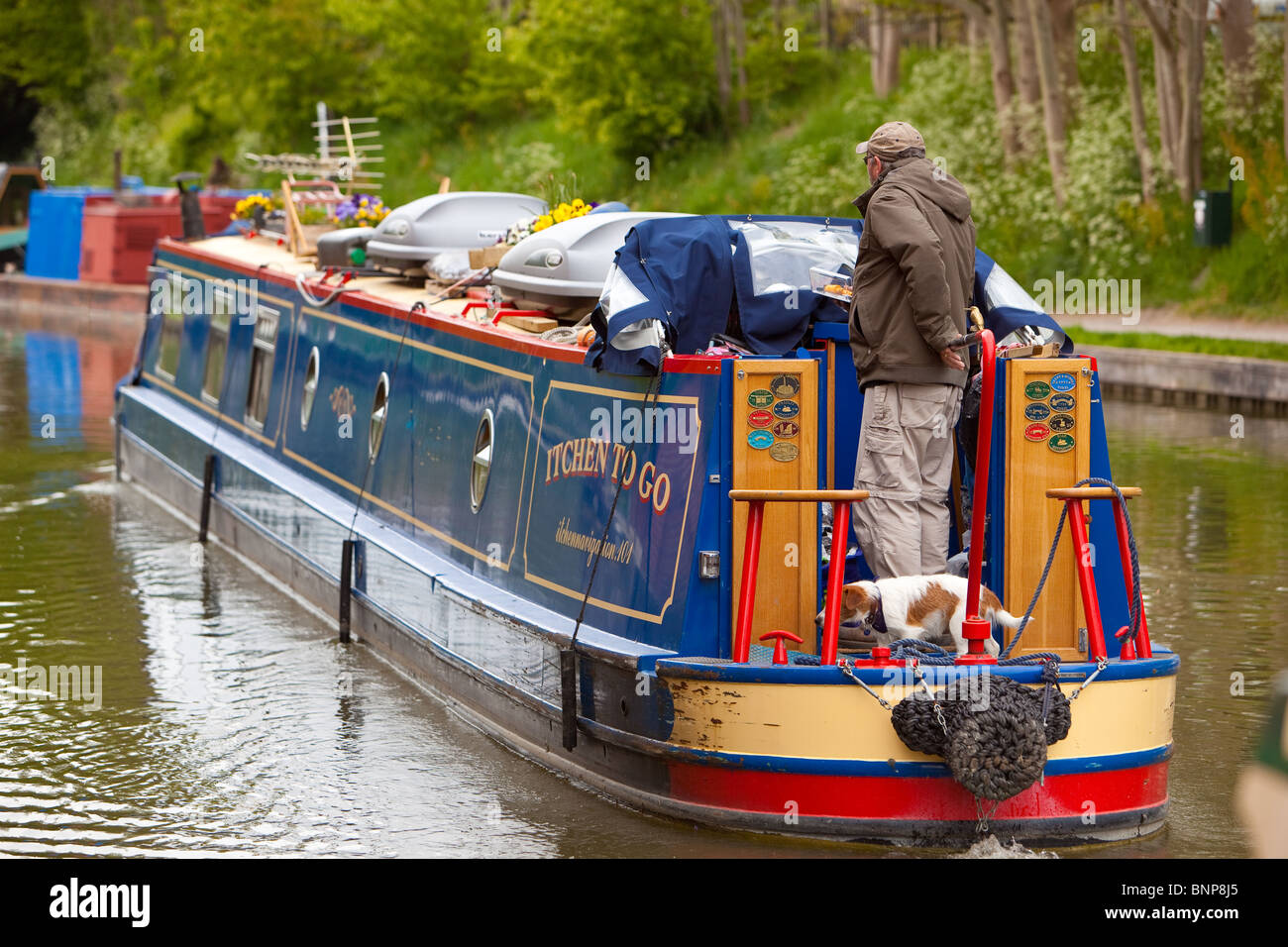 Canalboat manoeuvring at Caen locks. Kennet and Avon Canal. Wiltshire England Stock Photo
