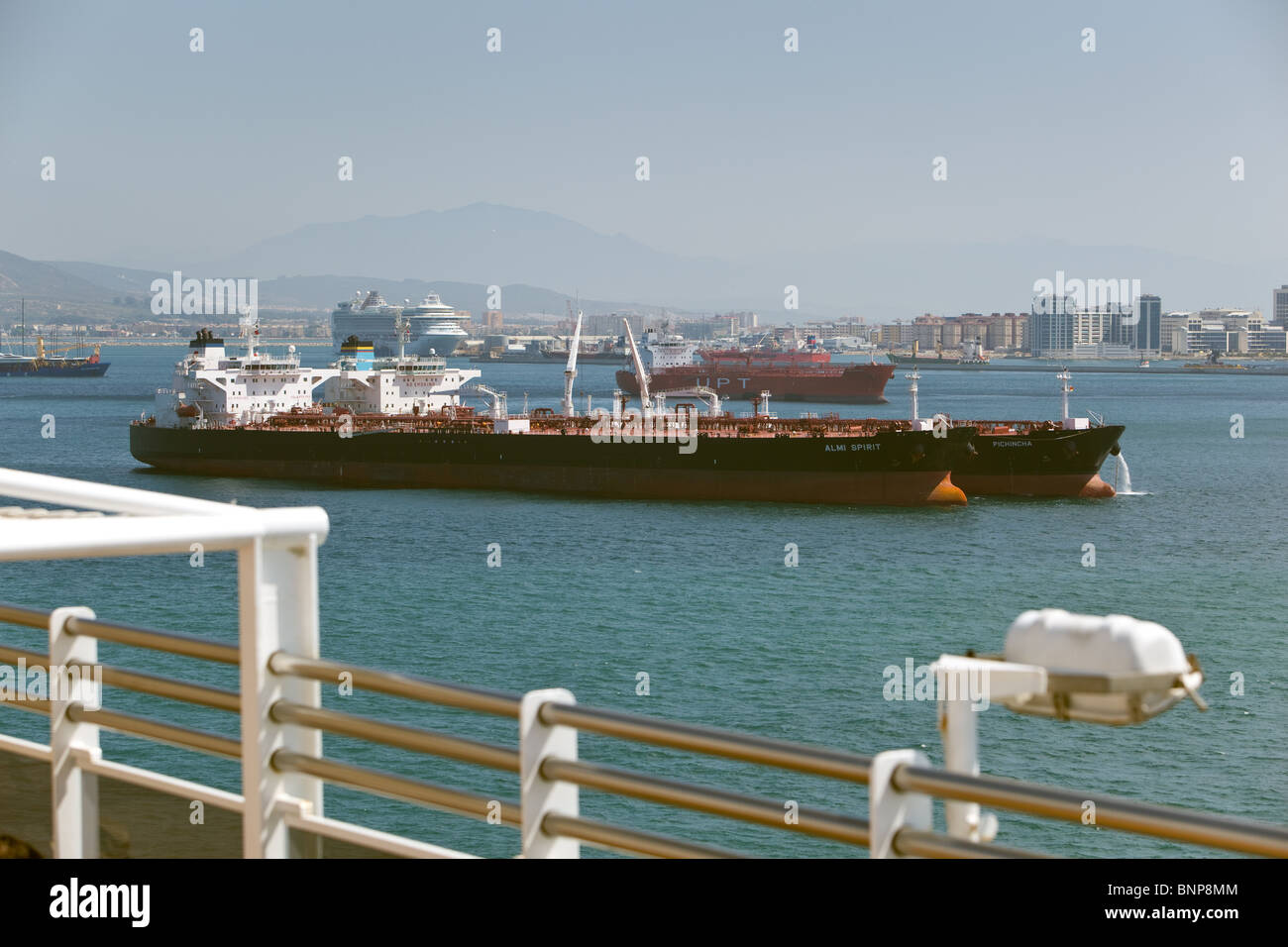 Arriving at Gibraltar; Cargo ships, Tankers at anchor lying off Gibraltar Stock Photo