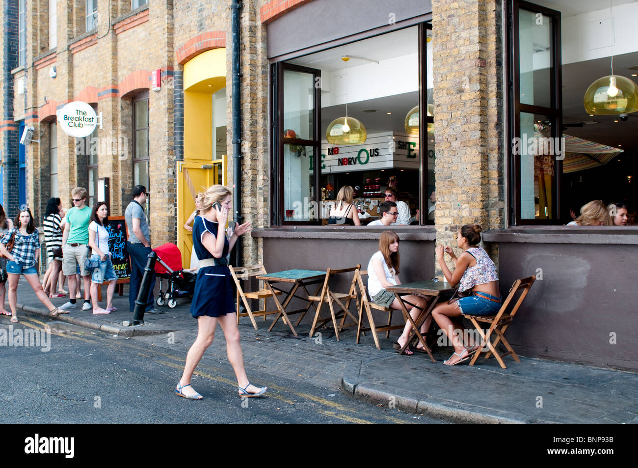 People queuing in front of The Breakfast Club restaurant, Hoxton, N1, London, UK Stock Photo