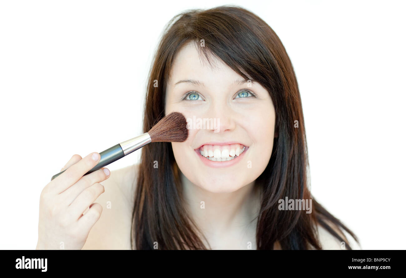 Cute woman using a powder brush Stock Photo - Alamy