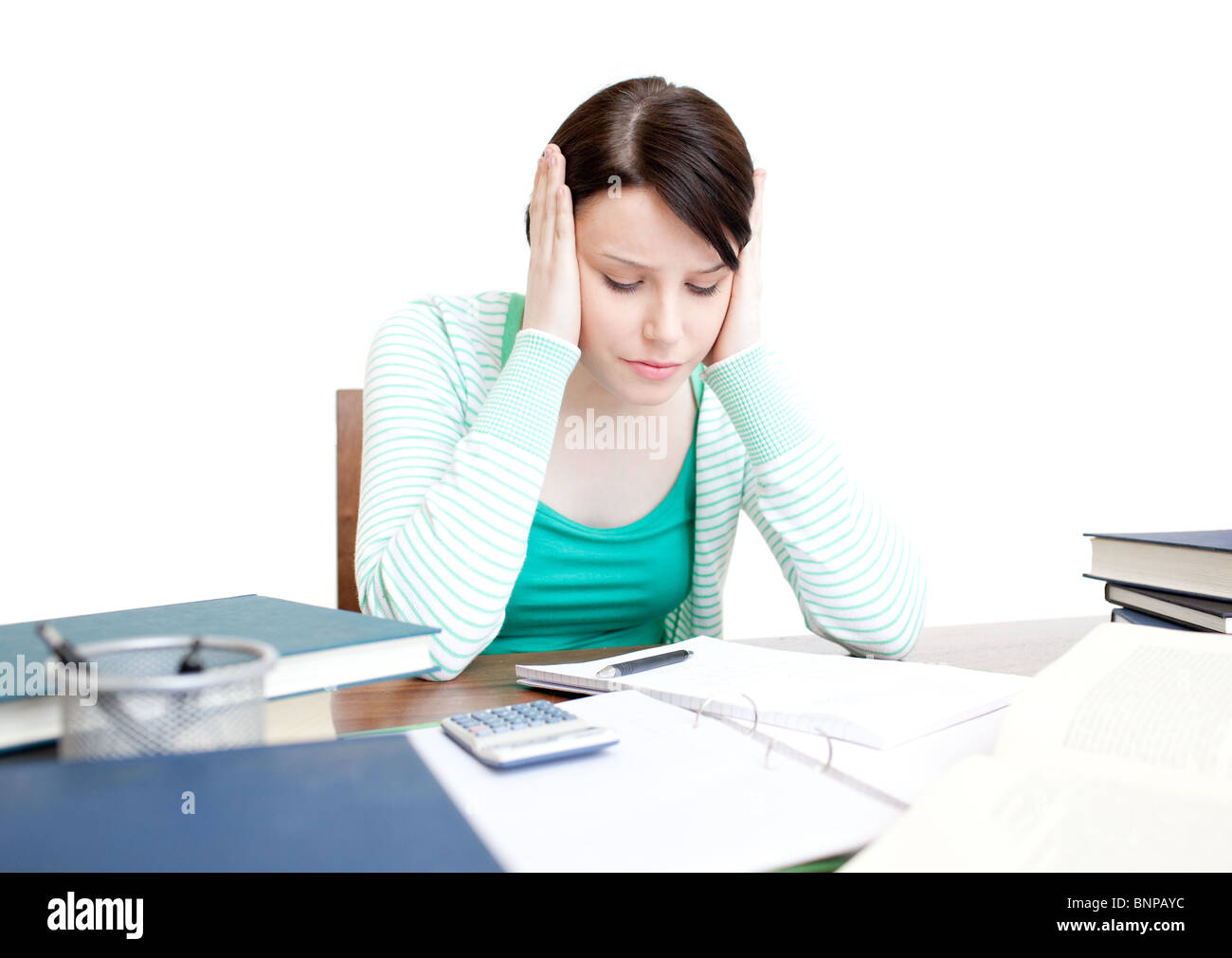 Stressed student doing her homework Stock Photo