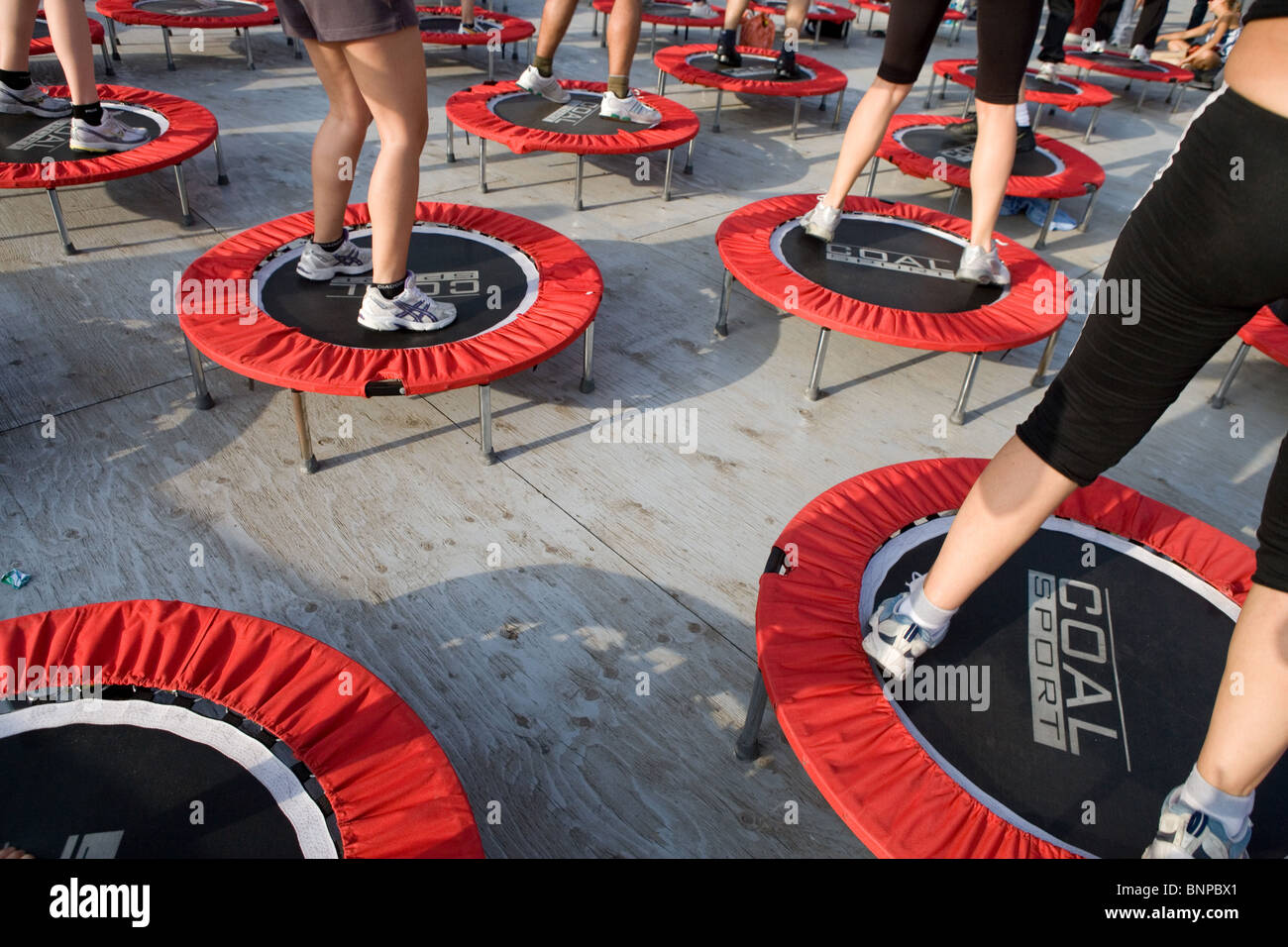 group of people at aerobics gym fitness class. legs jump jumping
