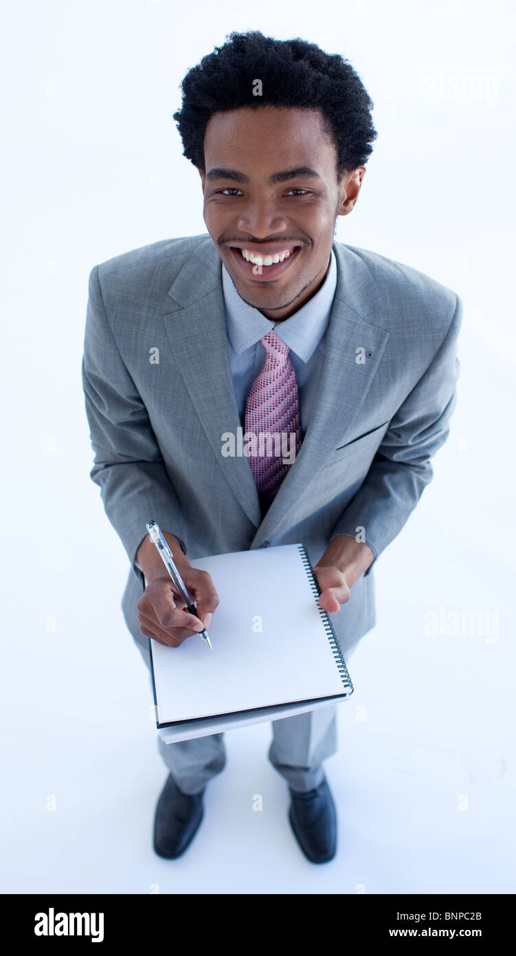 Businessman writing notes in a notebook Stock Photo