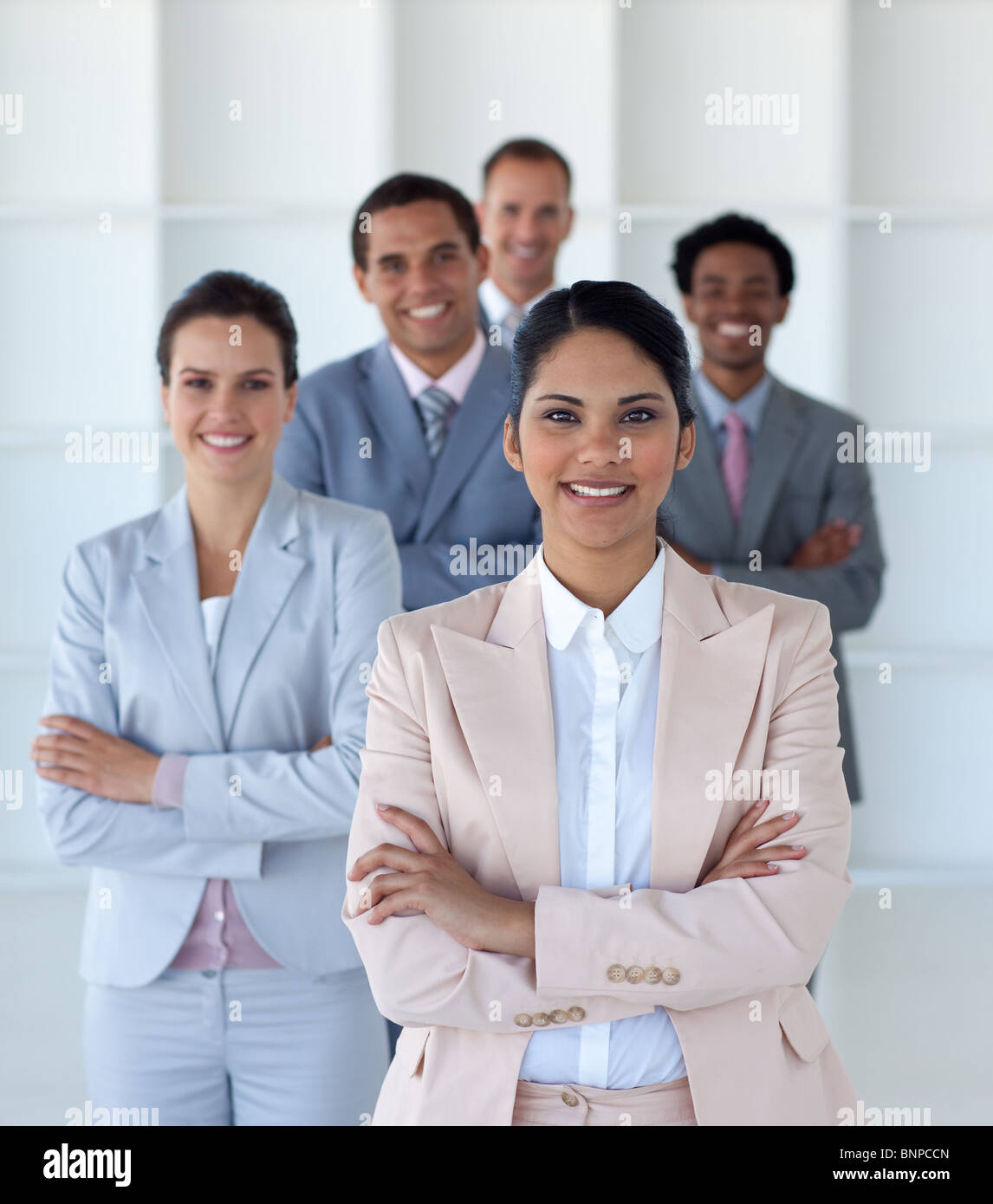 Business team standing in office looking at the camera Stock Photo - Alamy
