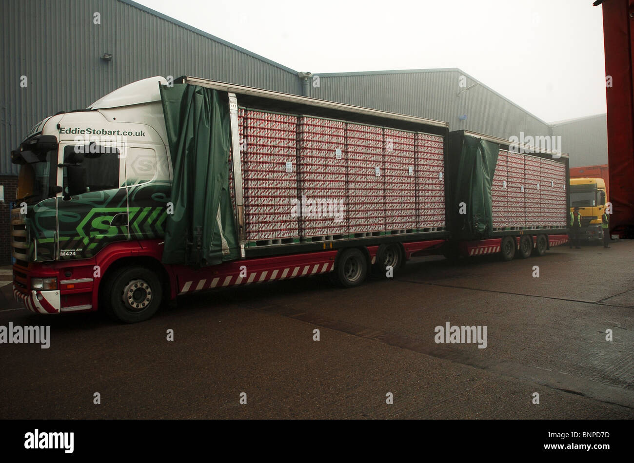 A truck delivers empty Red Stripe can to the, Charles Wells, Eagle brewery Bedford UK Stock Photo