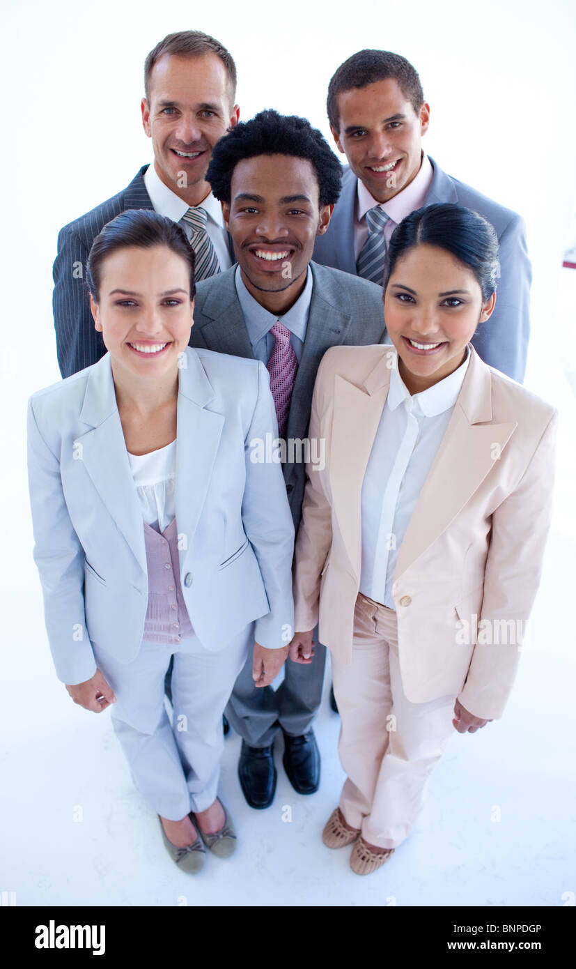 Happy business team smiling at the camera Stock Photo - Alamy