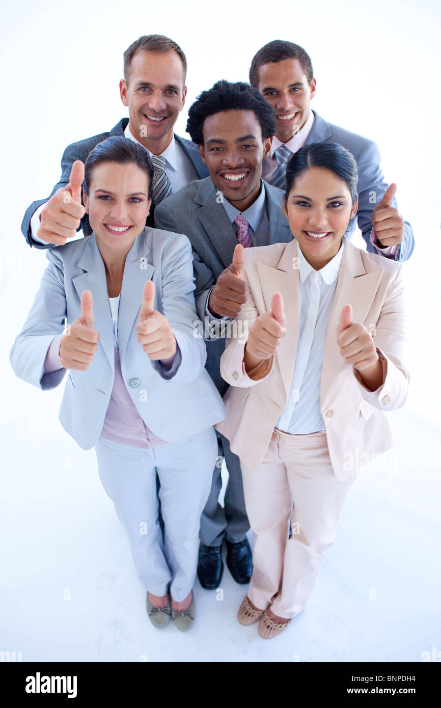 Happy business team with thumbs up Stock Photo - Alamy