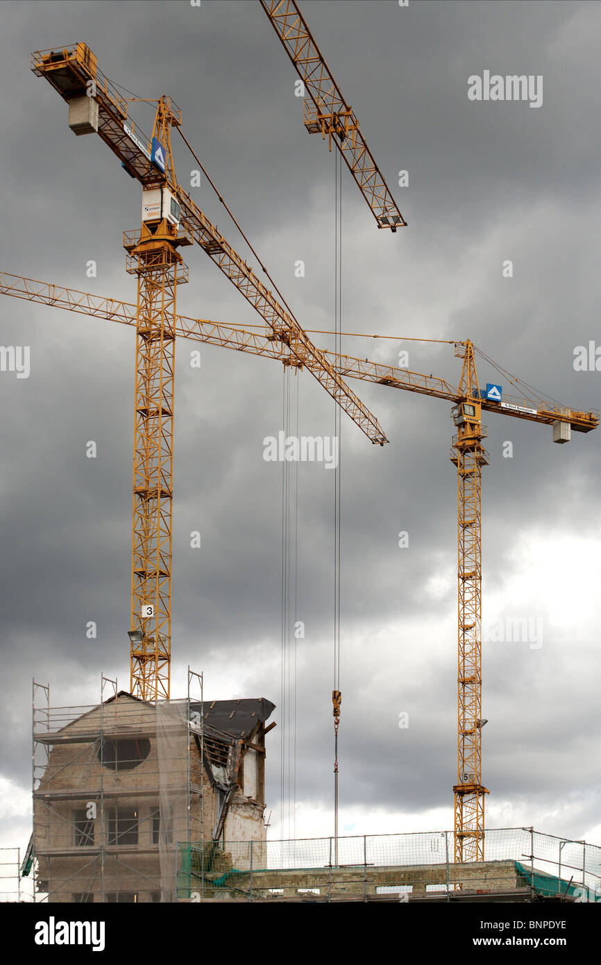Building cranes at a construction site in the Tempelhof Harbor, Berlin, Germany Stock Photo