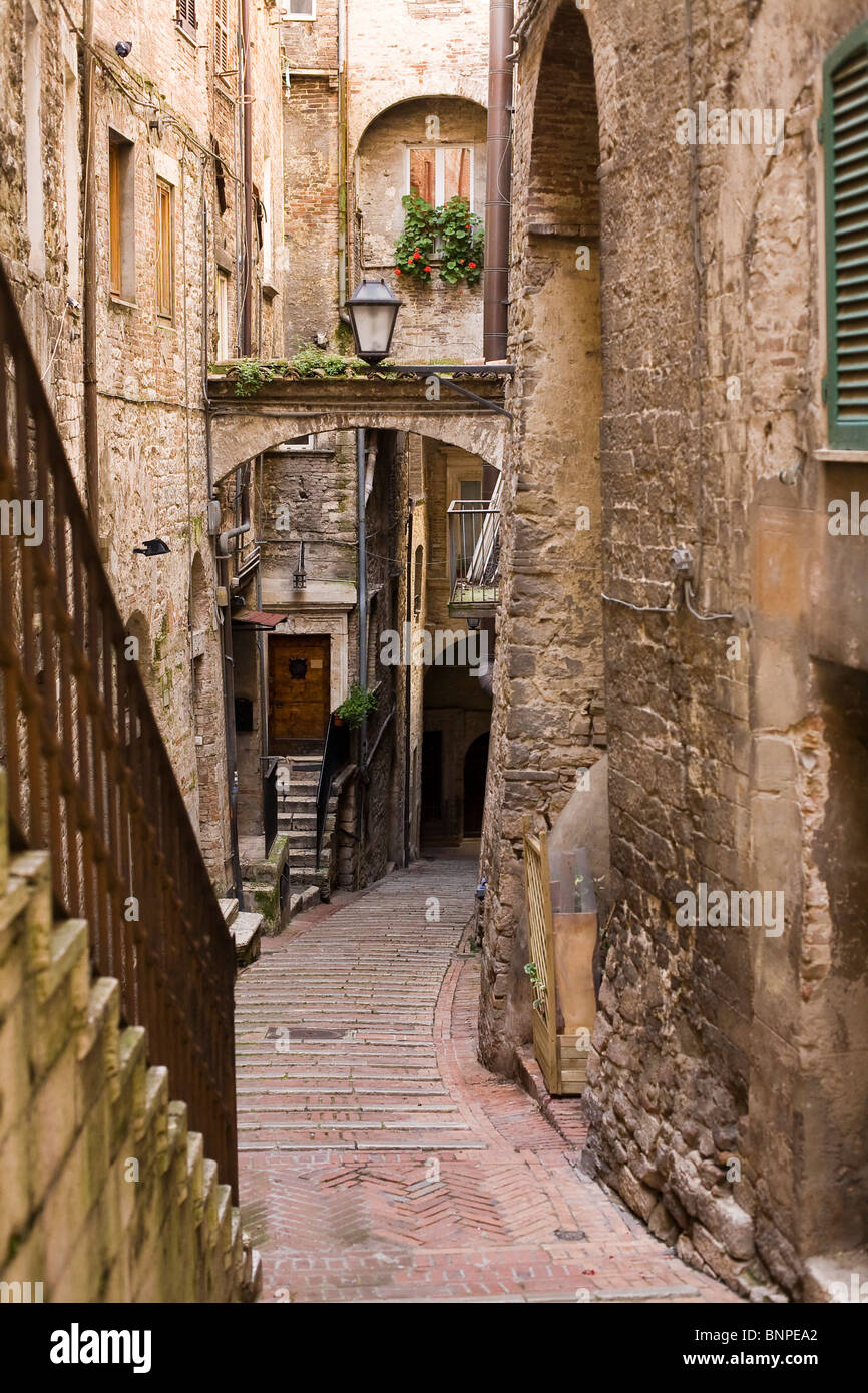 old medieval street with stone buildings Stock Photo