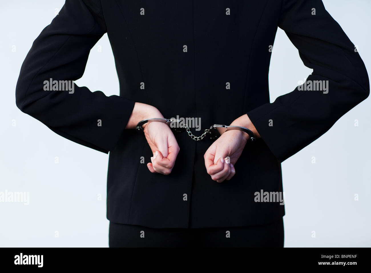 Business person handcuffed Stock Photo