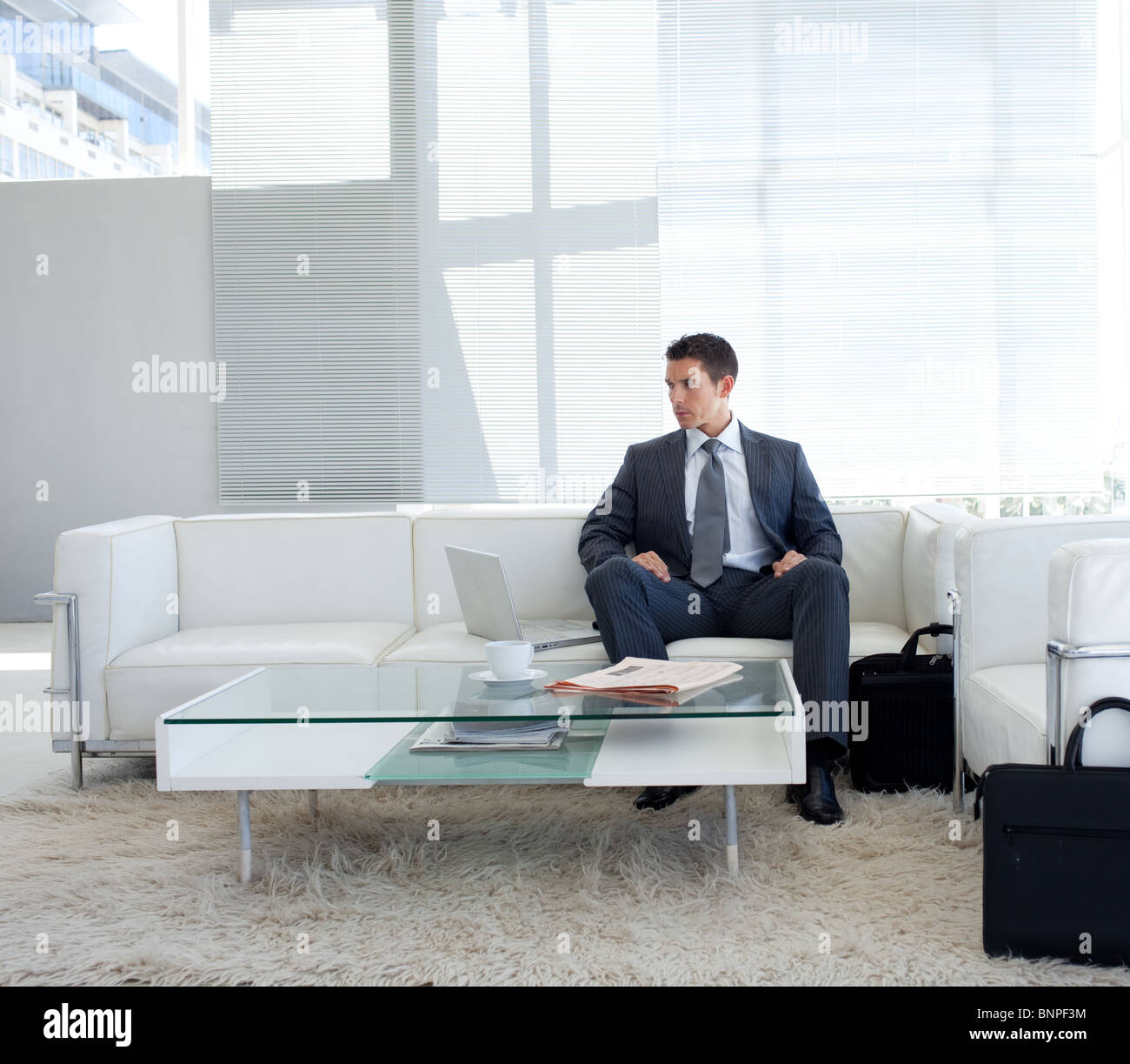 Businessman sitting in waiting room hi-res stock photography and images ...