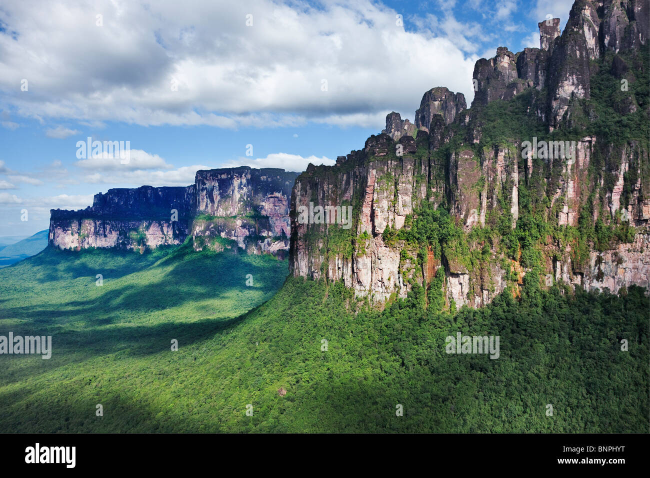 Tepuis are flat topped sand stone mountains with vertical flanks rising in elevation from 3000 meters over the forest Venezuela Stock Photo
