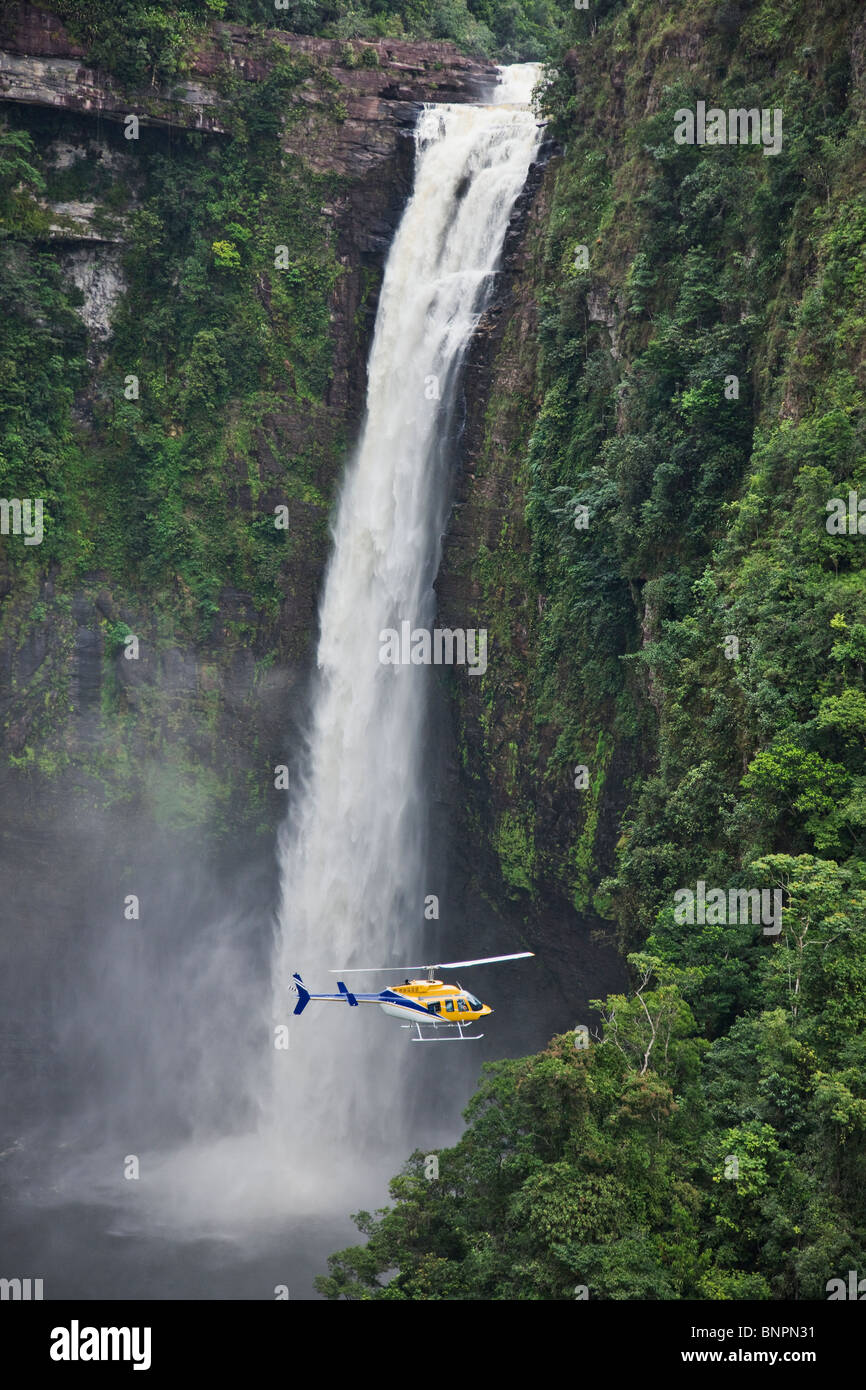 Tourists flying in a helicopter exploring waterfalls in Venezuela Stock Photo