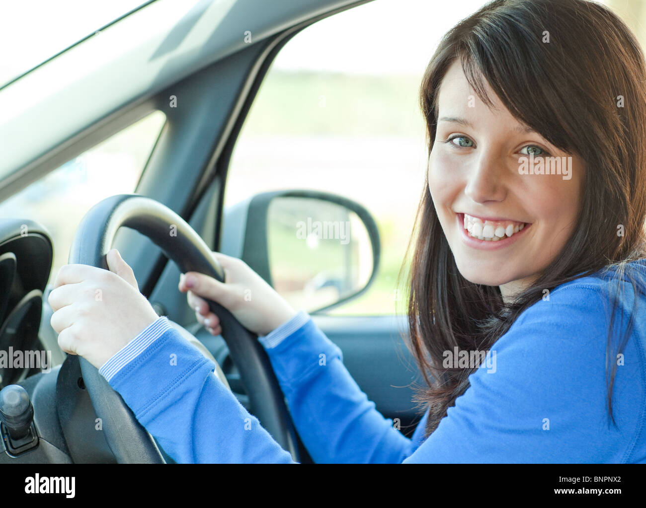Young woman driving Stock Photo