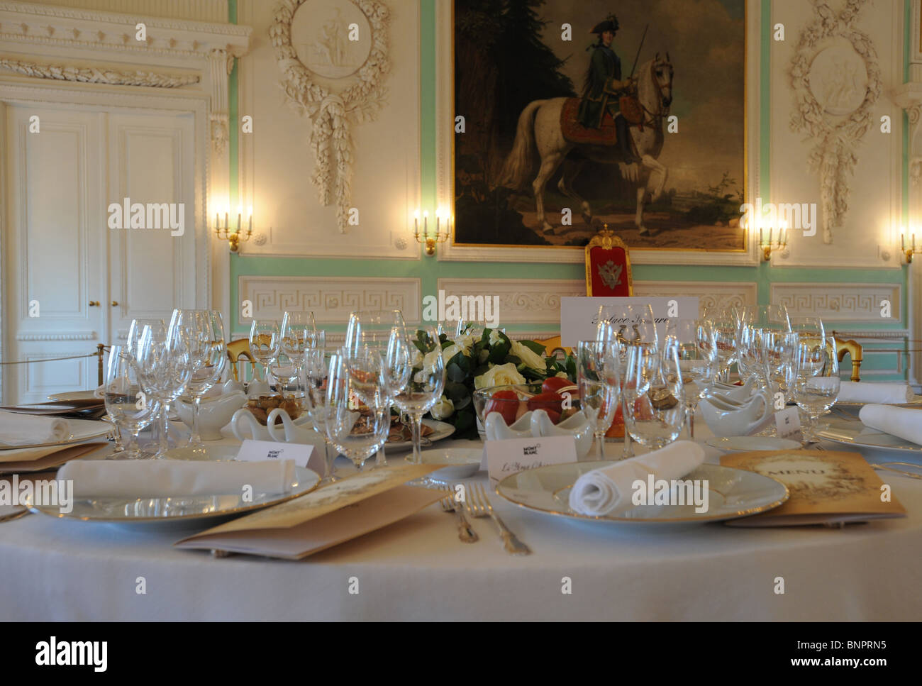 Table set for a gala dinner at the Peterhof Palace, Saint Petersburg, Russia Stock Photo