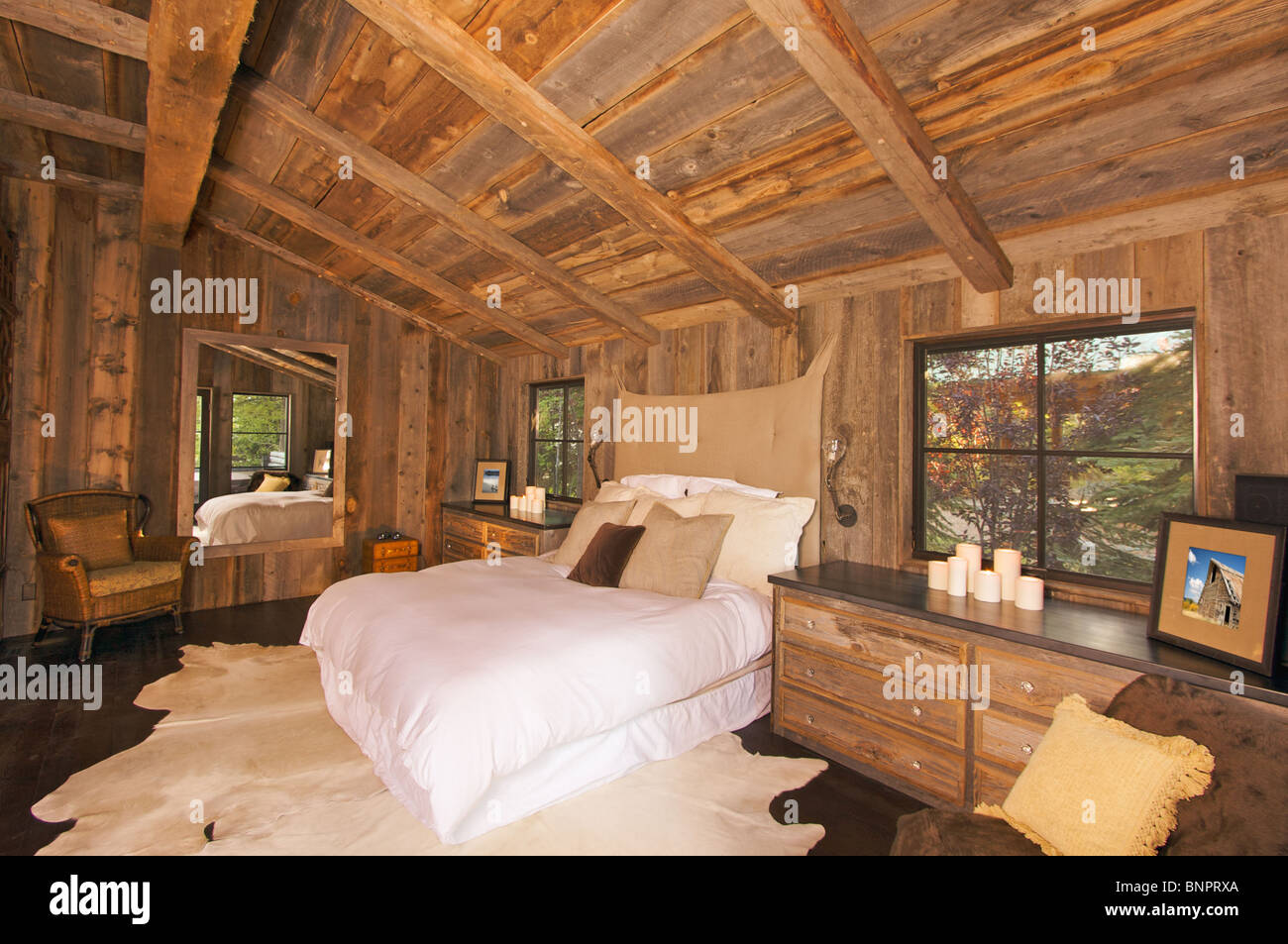 Luxurious Rustic Log Cabin Bedroom In A Rural Setting Stock