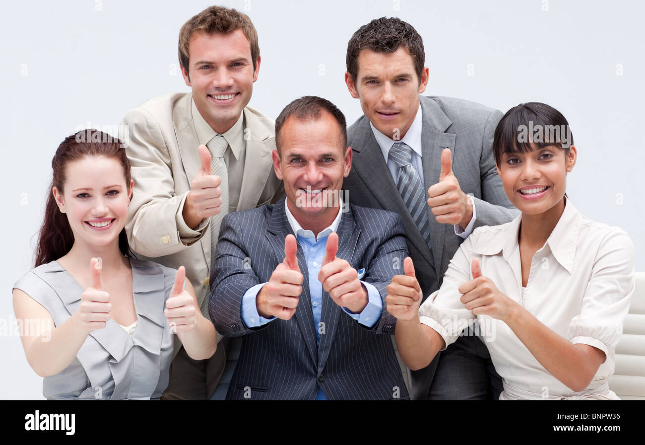 Happy business team with thumbs up Stock Photo - Alamy