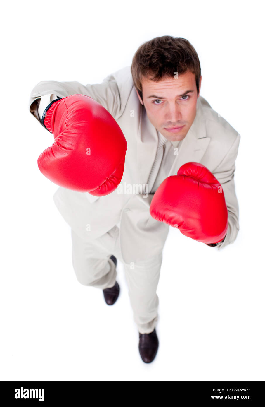 Selfassured businessman wearing boxing gloves Stock Photo Alamy