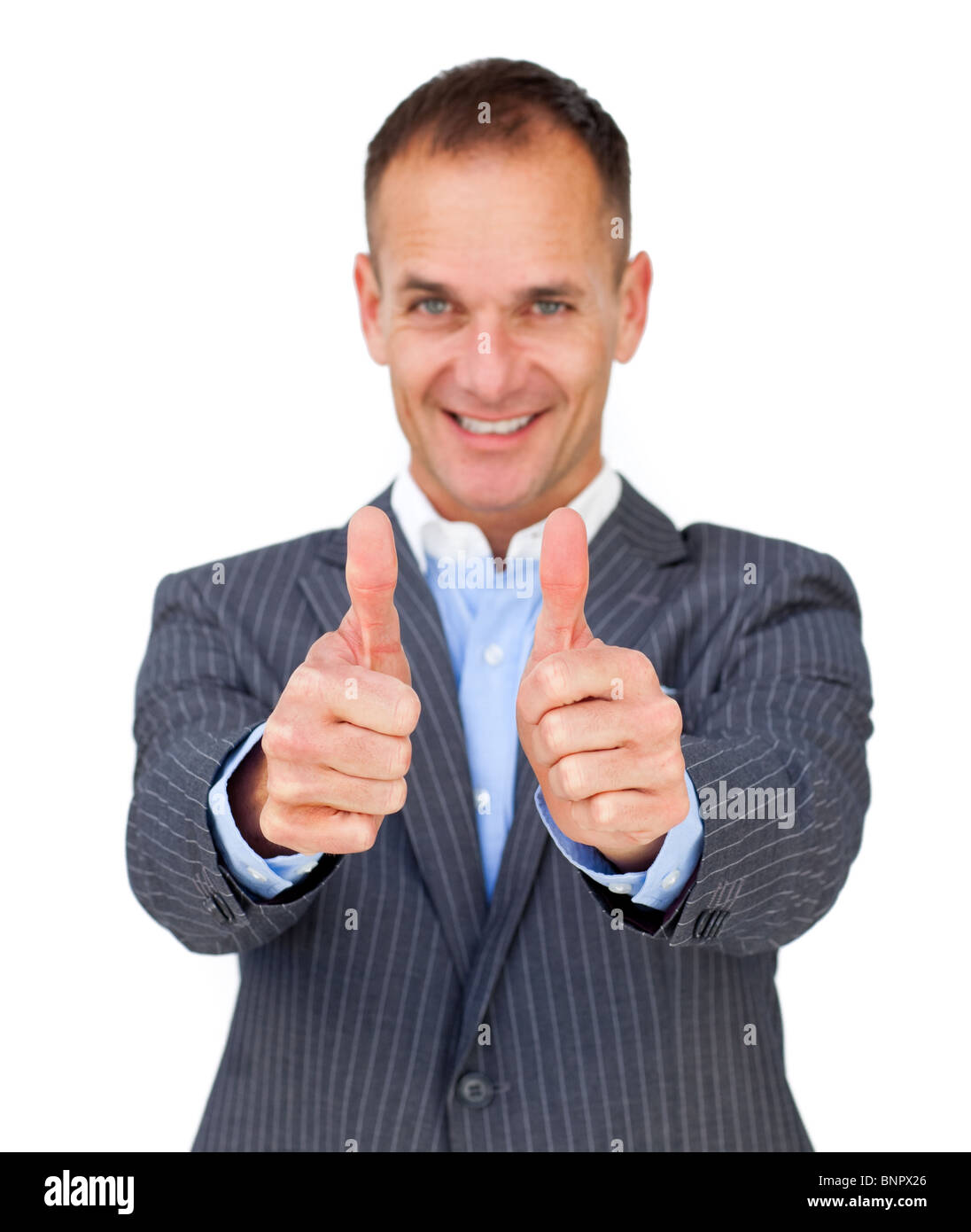 Successful businessman with thumbs up Stock Photo - Alamy