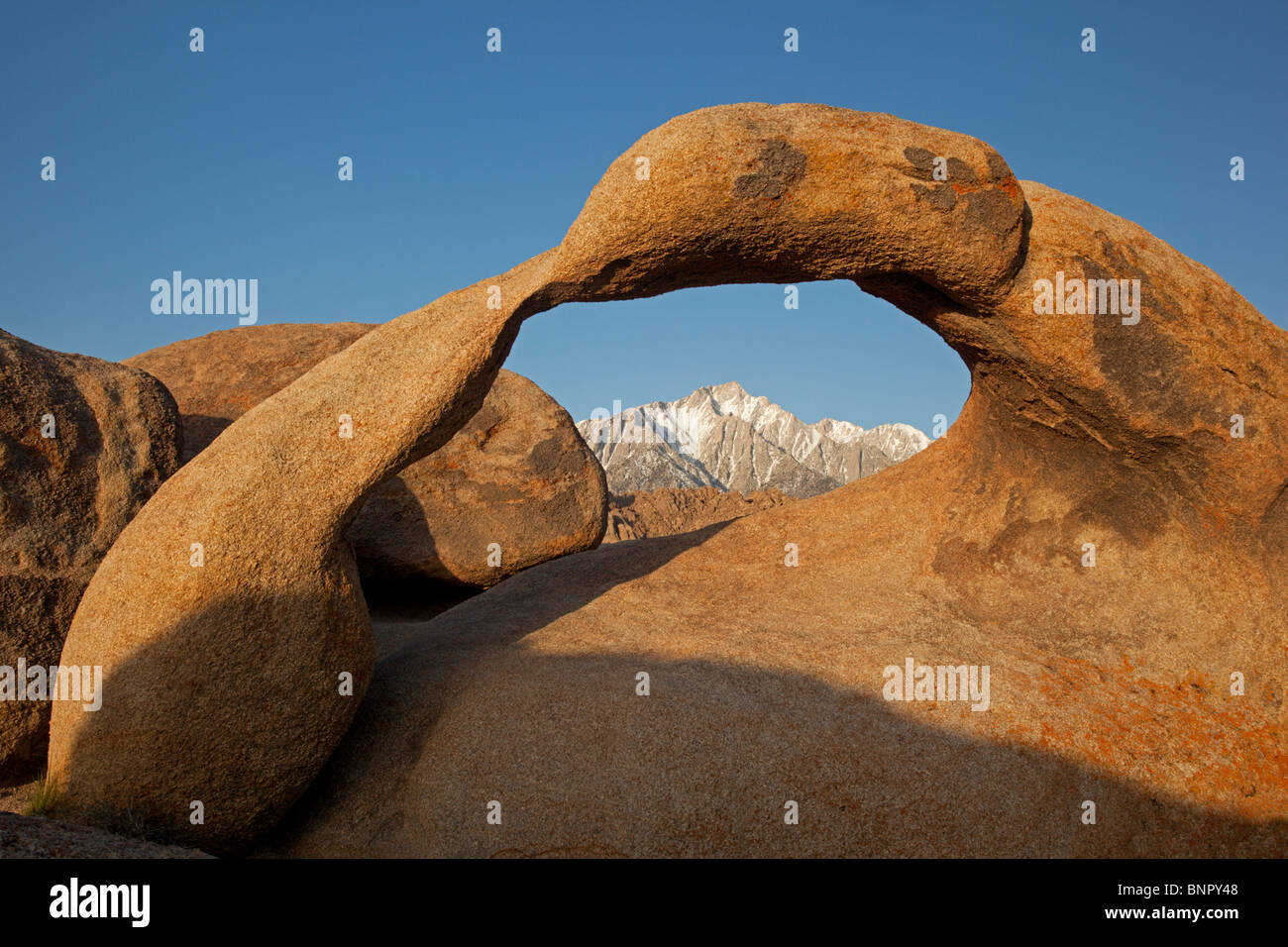 Mobius Arch frames Mount Whitney in the Sierras of California. Stock Photo