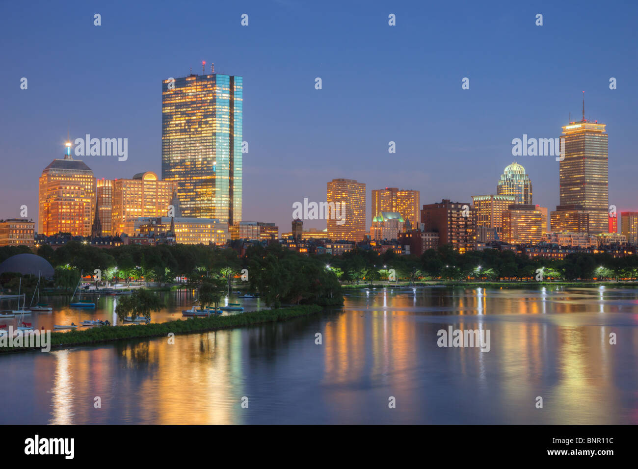 The Boston skyline including the John Hancock and Prudential Center viewed over the Charles River at twilight in Boston, Massachusetts. Stock Photo