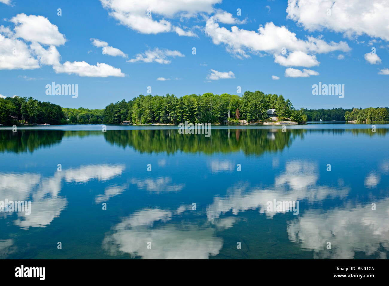Clouds reflected in Clear Lake in Parry Sound District, Ontario, Canada