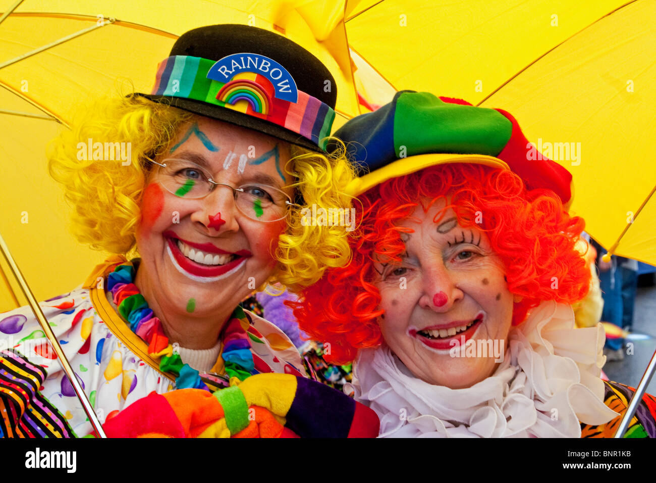 Two ladies attired in clown costumes for Vernon's winter carnival