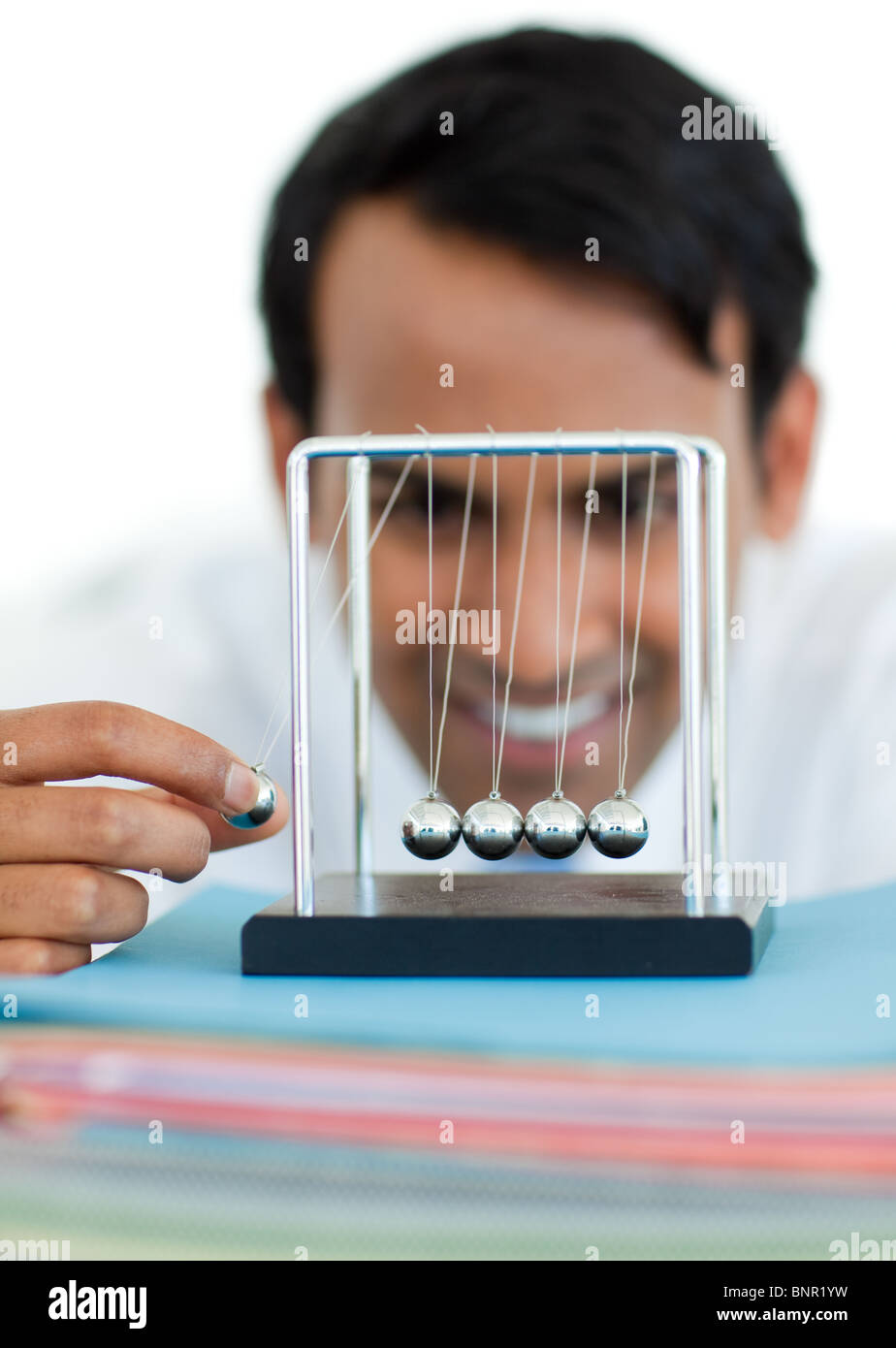 Young businessman having fun with balls Stock Photo Alamy