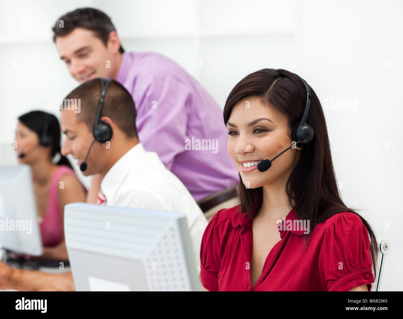 Smiling Customer service representative with headset on Stock Photo - Alamy