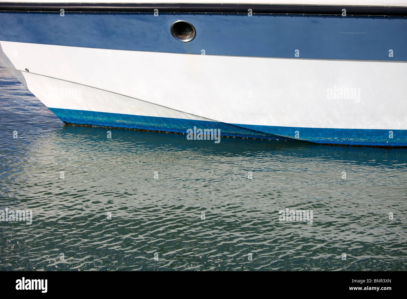 White and blue boat on water Stock Photo - Alamy