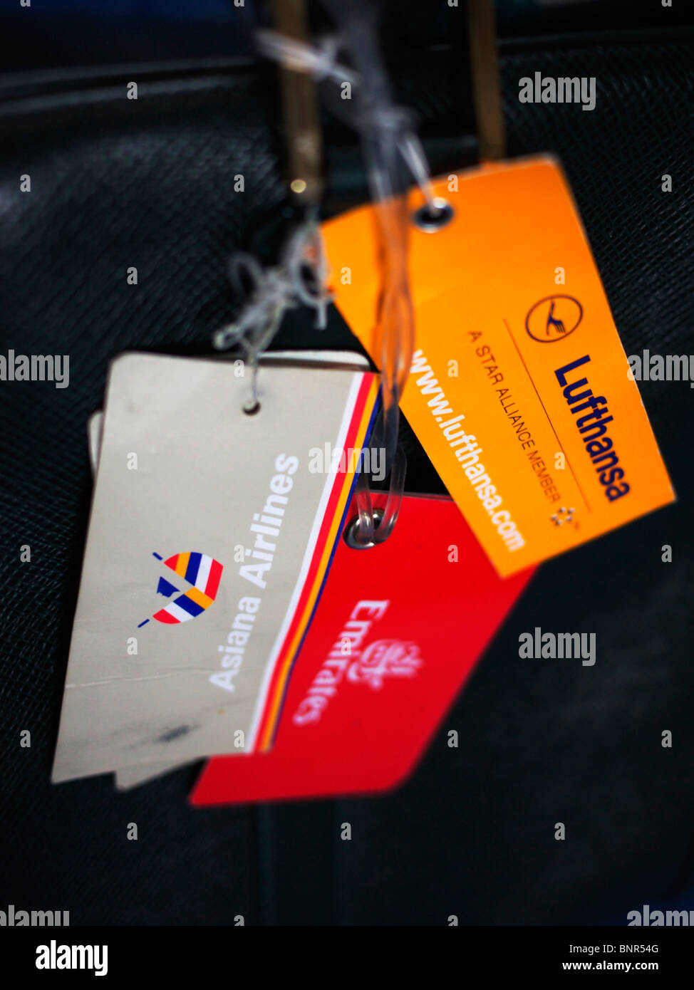 Passenger name tags bearing logos of different carriers Stock Photo