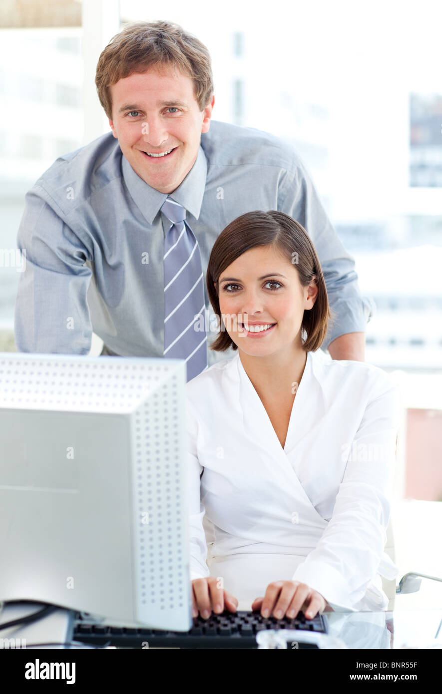 Helpful Manager Confident manager helping colleague hi-res stock photography and images ...