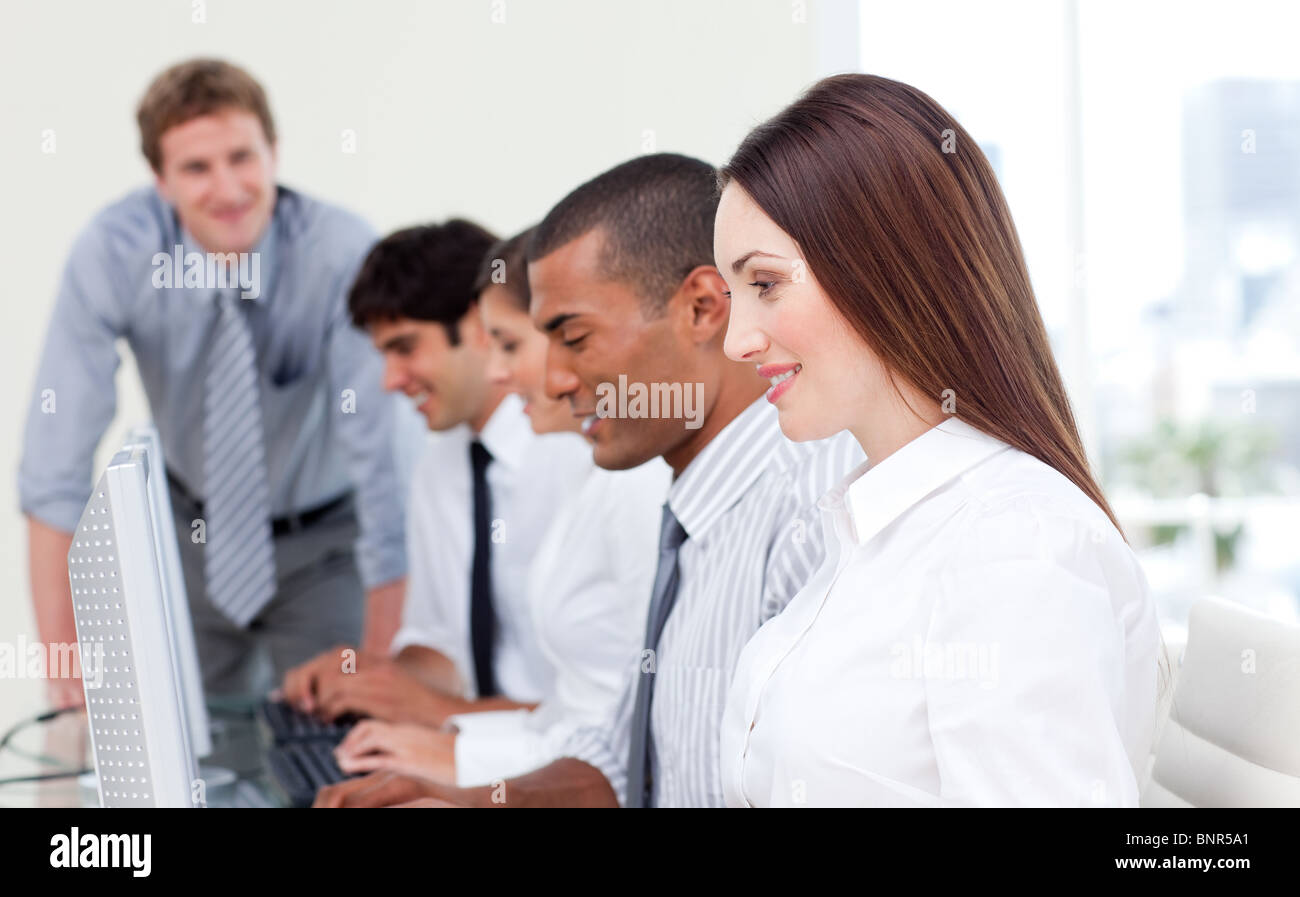 Multi-cultural business team at work Stock Photo - Alamy