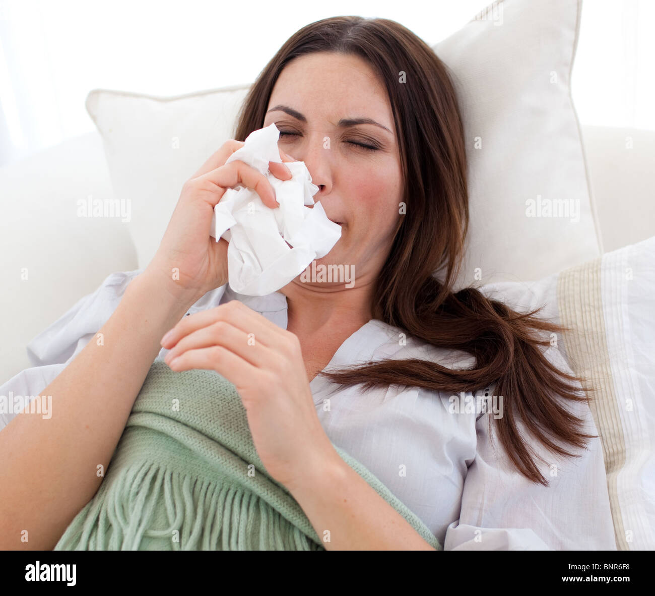 Close-up of a young woman blowing Stock Photo - Alamy