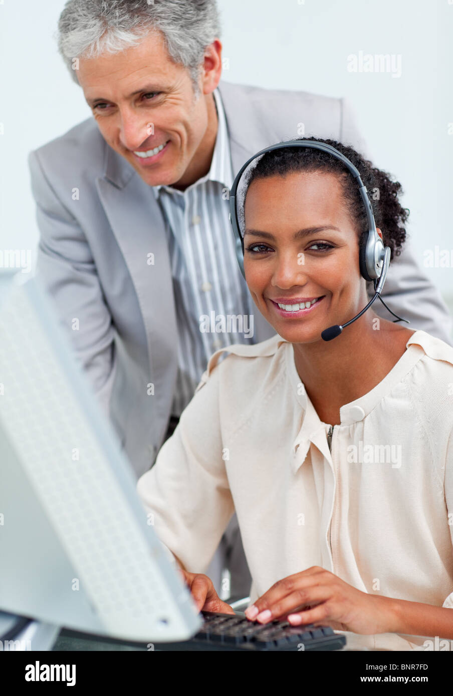 Charming mature manager checking his employee's work Stock Photo - Alamy