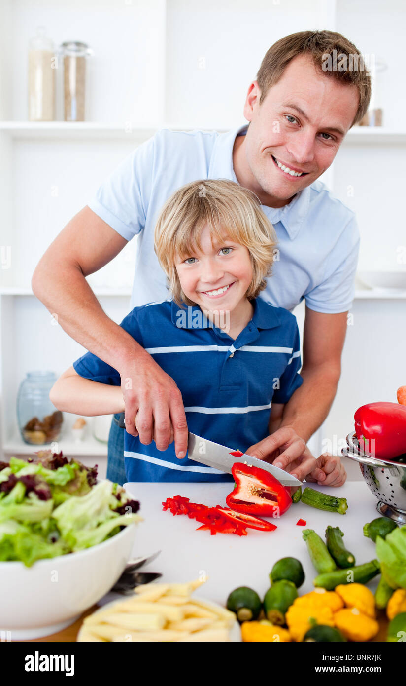 Cheerful father and his son cooking Stock Photo - Alamy
