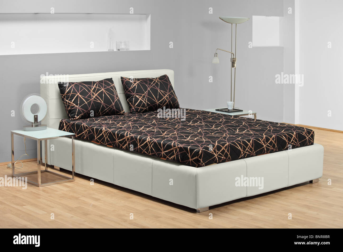 A view of a bed in a bedroom Stock Photo - Alamy