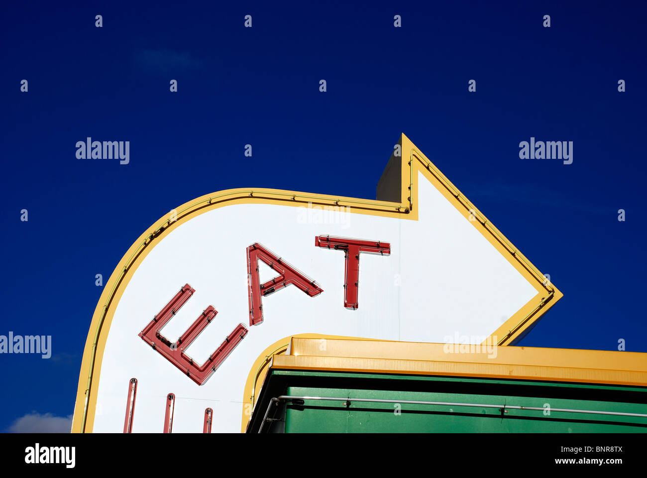 EAT sign for restaurant along the interstate. Stock Photo