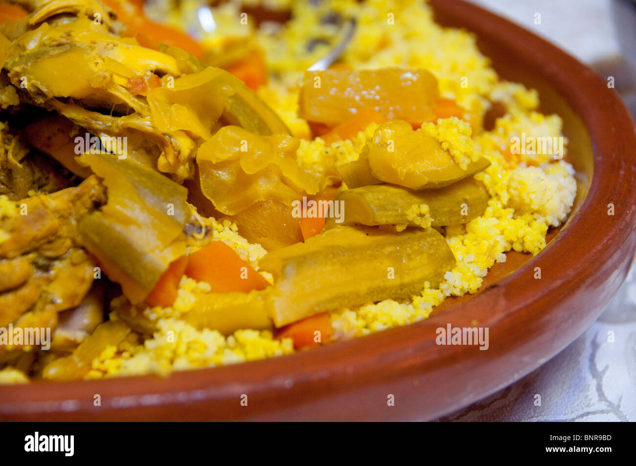 Morocco, Tetouan. Traditional Moroccan meal of couscous, chicken, and