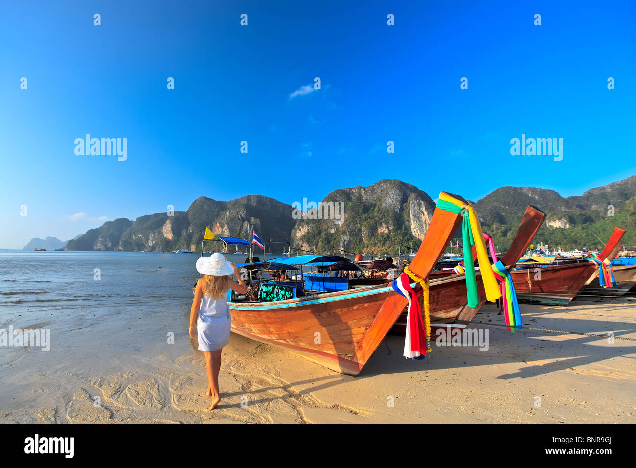 Traditional Thai longtail boats at Phi phi island Stock Photo