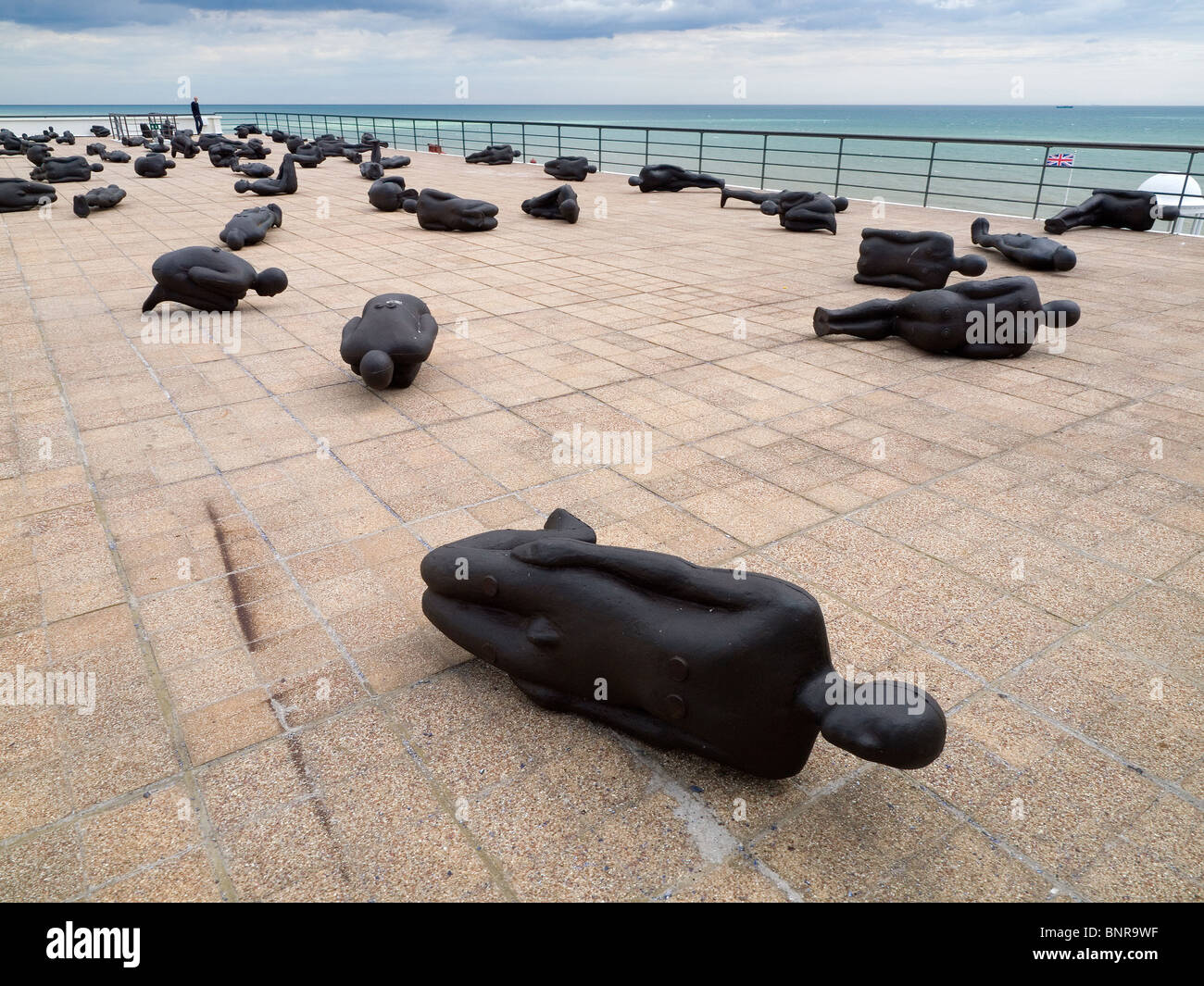 Exhibition of statues 'Critical Mass' by Antony Gormley on the roof of the De La Warr Pavilion Bexhill on Sea East Sussex Stock Photo