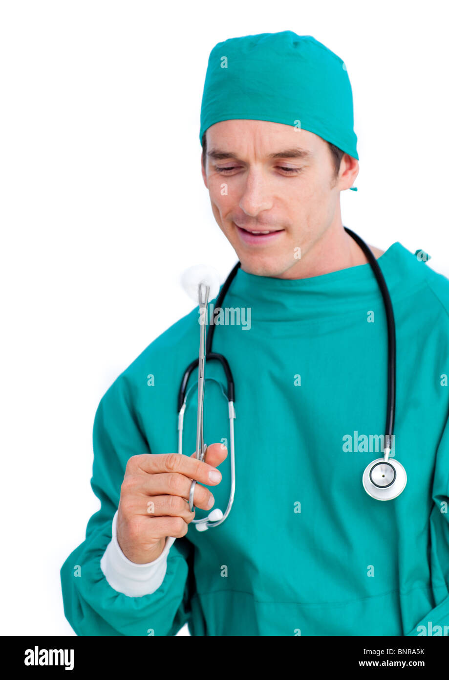 Surgeon Using Forceps Portrait of a serious surgeon holding surgical forceps Stock Photo - Alamy