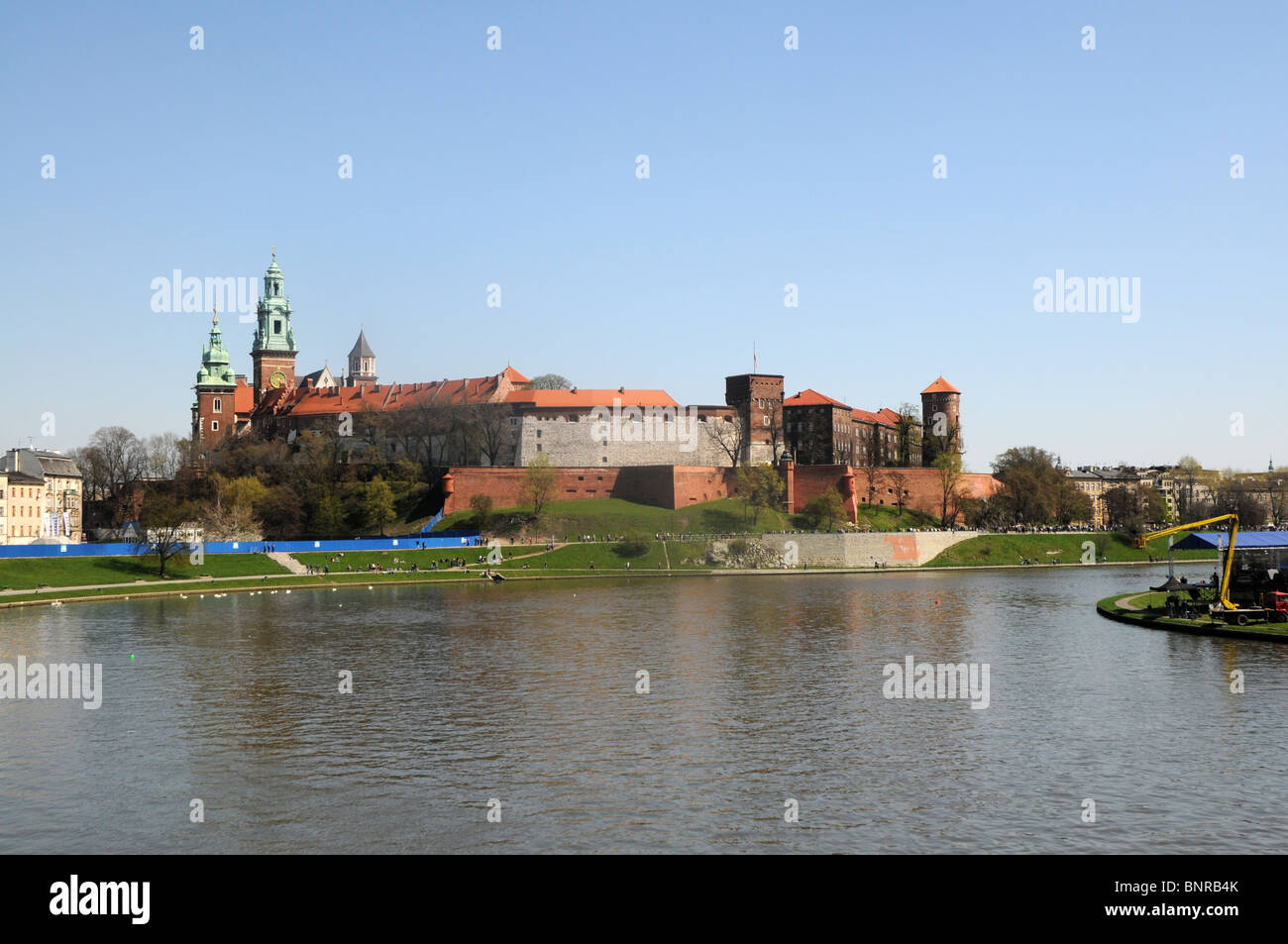 Wawel architectural complex with Wawel Castle and Cathedral turrets and Vistula River in Cracow, Poland Stock Photo