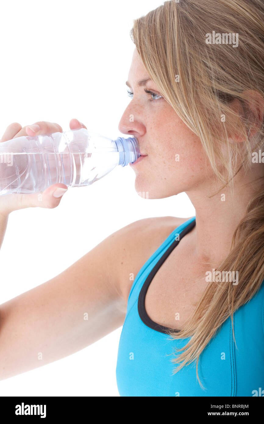 female athlete hydrating after work out Stock Photo