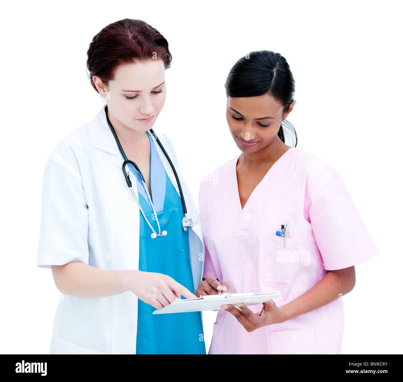 Two nurses talking about a report Stock Photo Alamy
