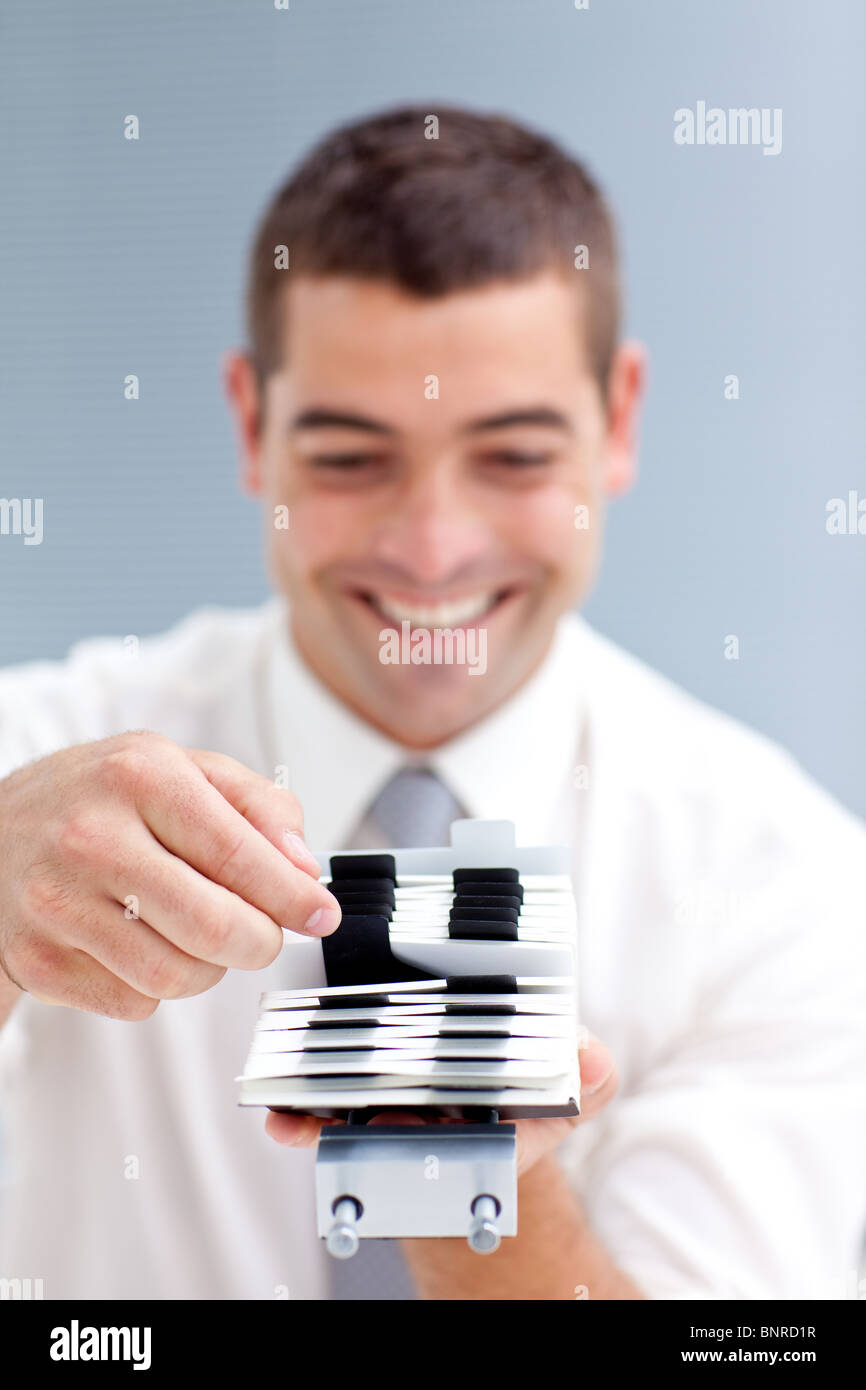 Businesscard holder with a businessman Stock Photo Alamy