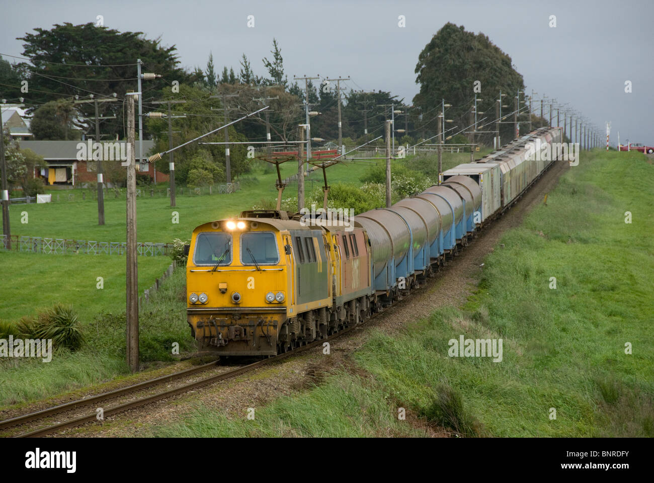 Two class EF electric engines pulling a train of milk tankers,  near Fielding, Manawatu, North Island, New Zealand Stock Photo
